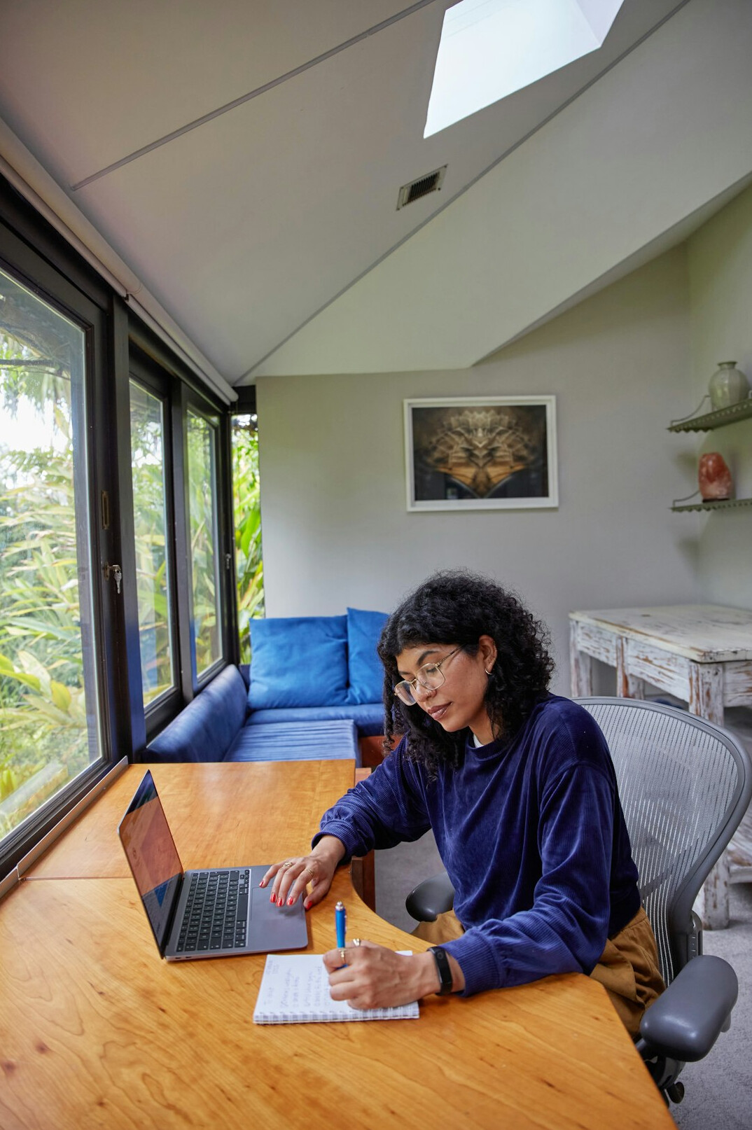 writer at desk with notebook