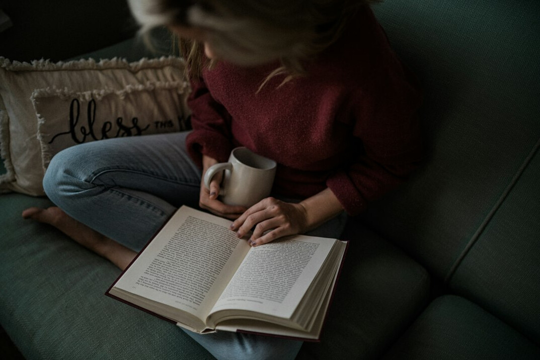 person reading mystery book